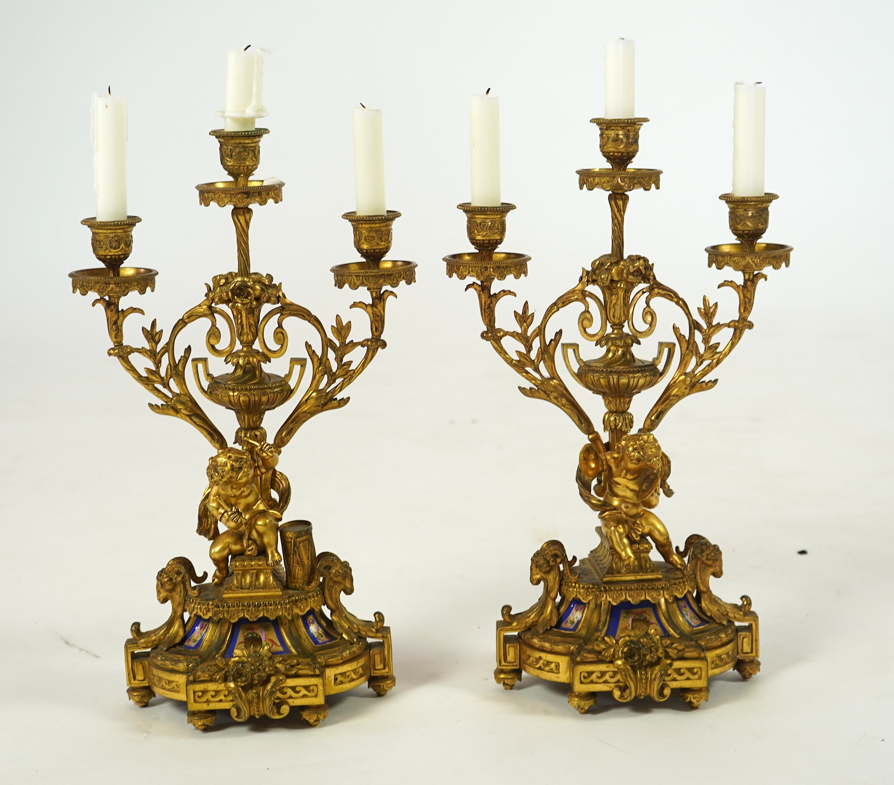 A pair of 19th century French Louis XVI style ormolu three light candelabra
